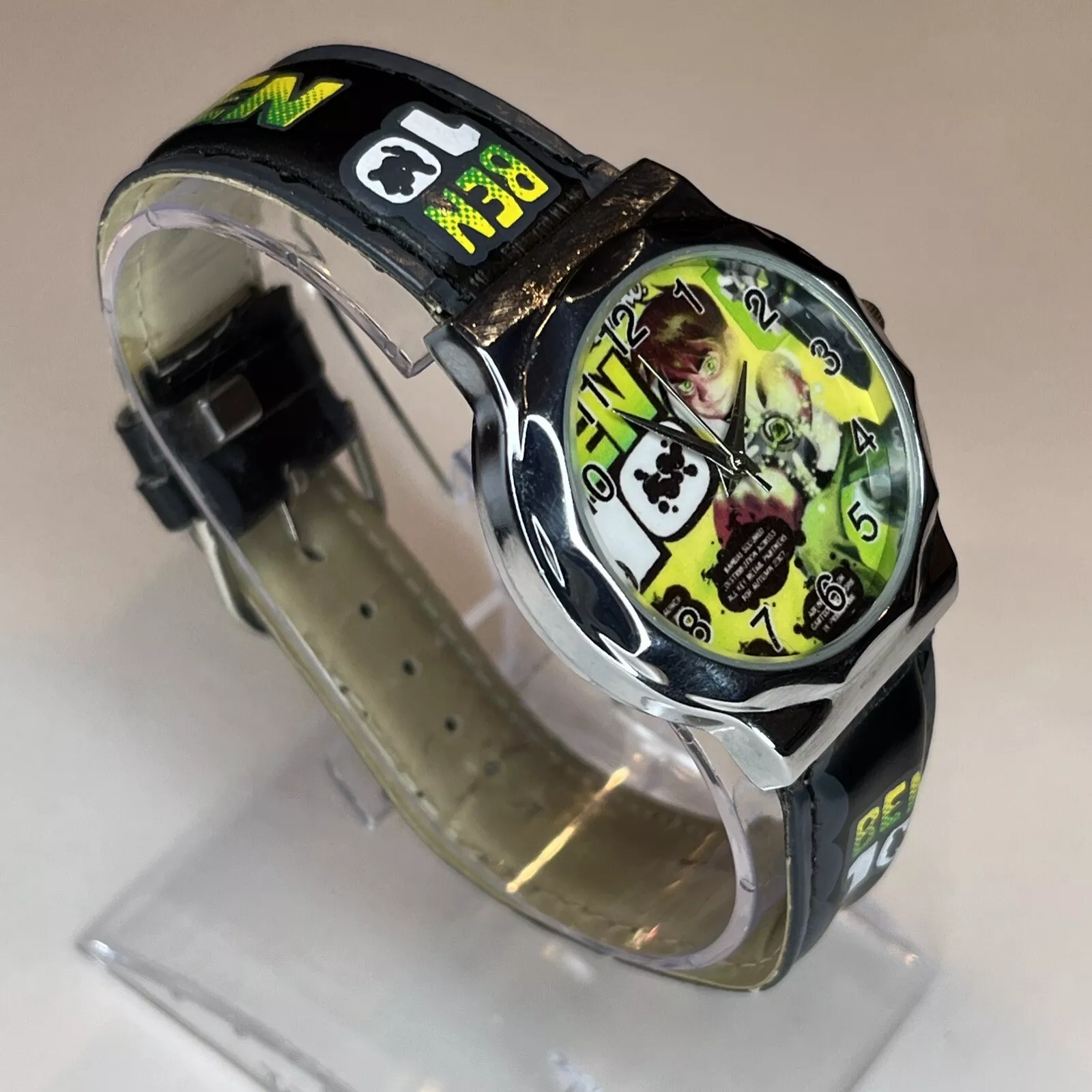 Easy-to-read Ben 10 analog watch for boys with a silver case and green faux leather. view 2